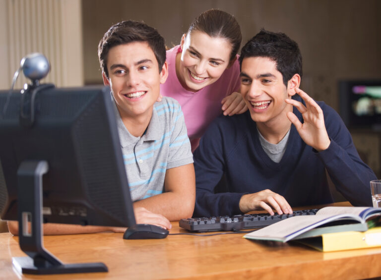 happy-students-studying-together-at-home-on-comput-2026-01-11-09-41-43-utc